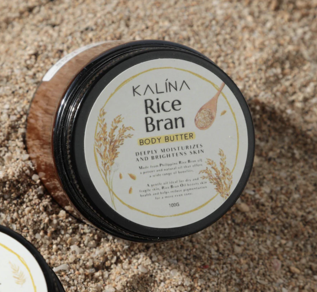 A tub of rice bran on some sand
