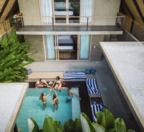 A view of a private pool and people lounging