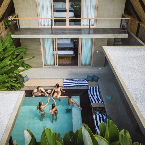 A view of a private pool and people lounging