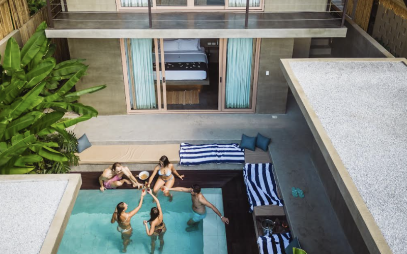 A view of a private pool and people lounging