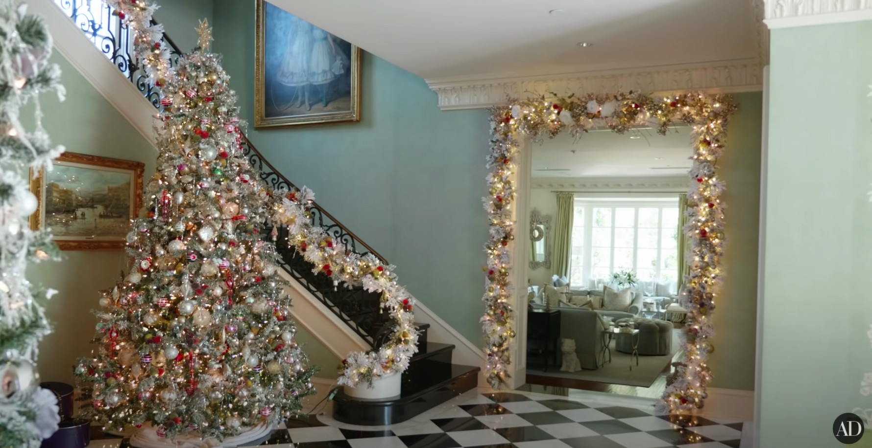 A photo of a grand staircase with a Christmas tree